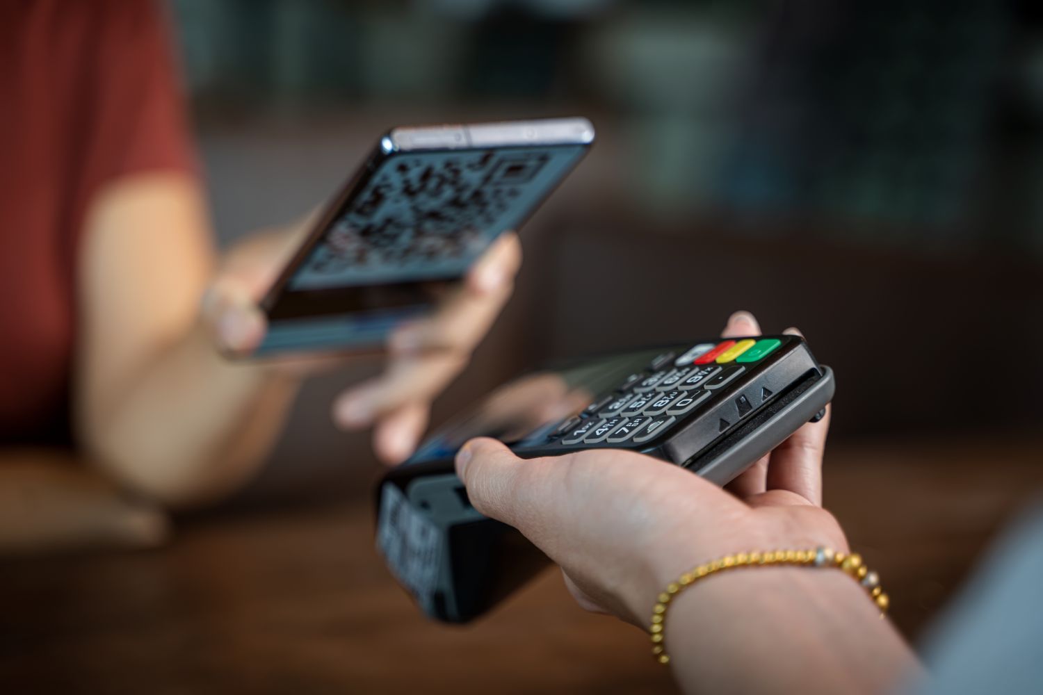 Close up woman hand holding using smartphone with a digital wallet app