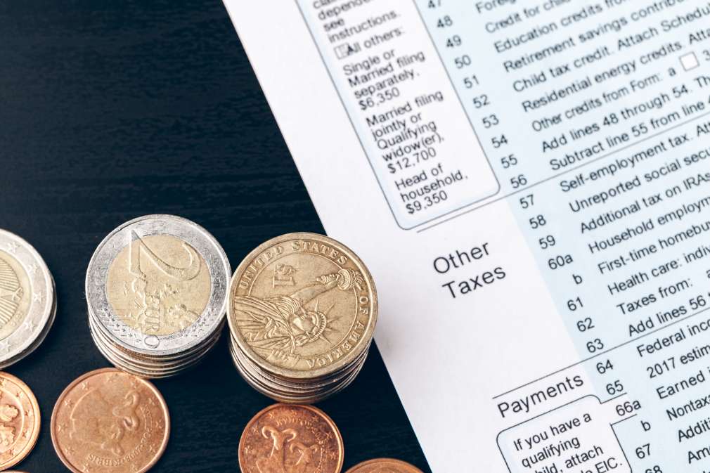 Close-up of accounting documents with money coins