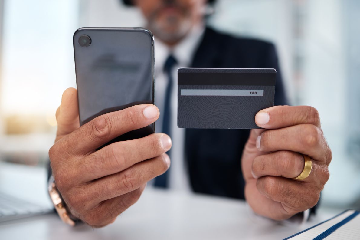 Hands, phone and credit card man in office