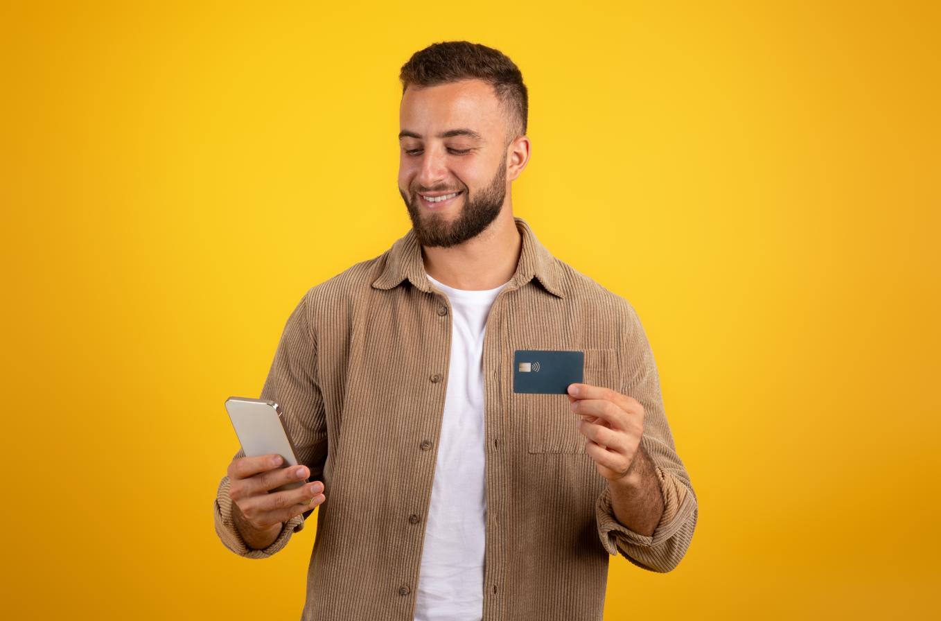 Professional using his phone for online banking to manage his Suisse Bank offshore account