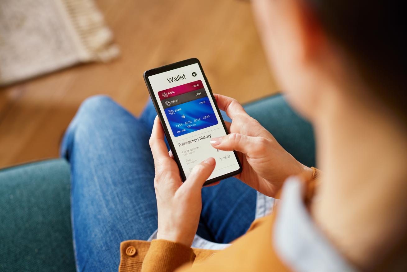 Woman checking digital wallet on smartphone